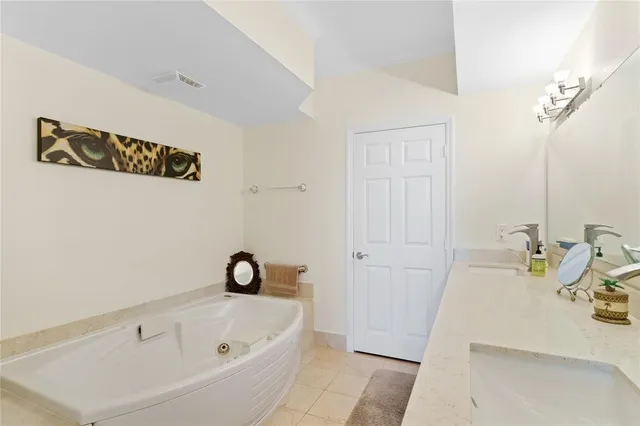 a bathroom with a bathtub and a sink