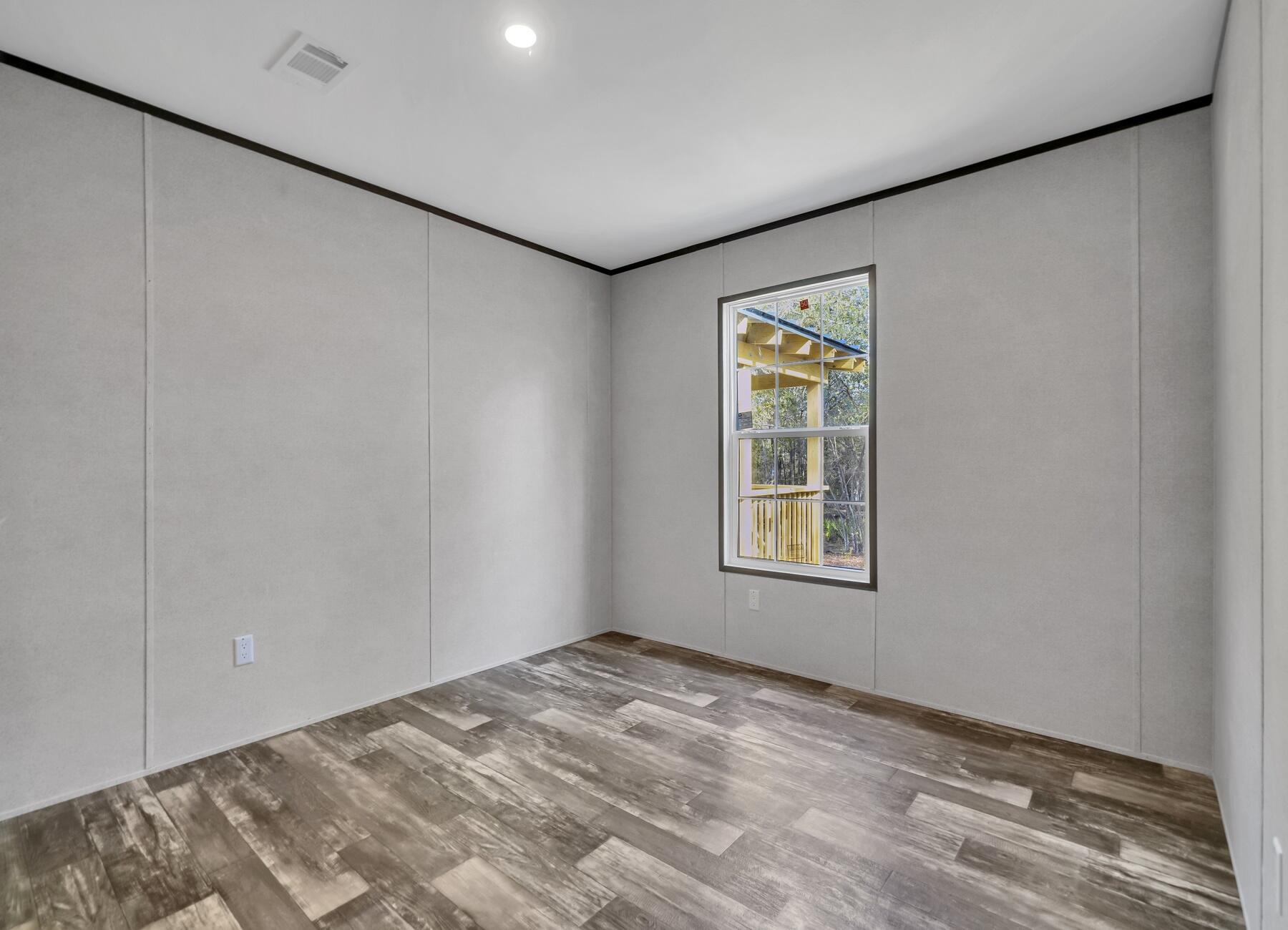 173 Gregory Dean Lane DeFuniak Springs, FL 32433 - Photo 14 of 24 a view of an empty room with a window