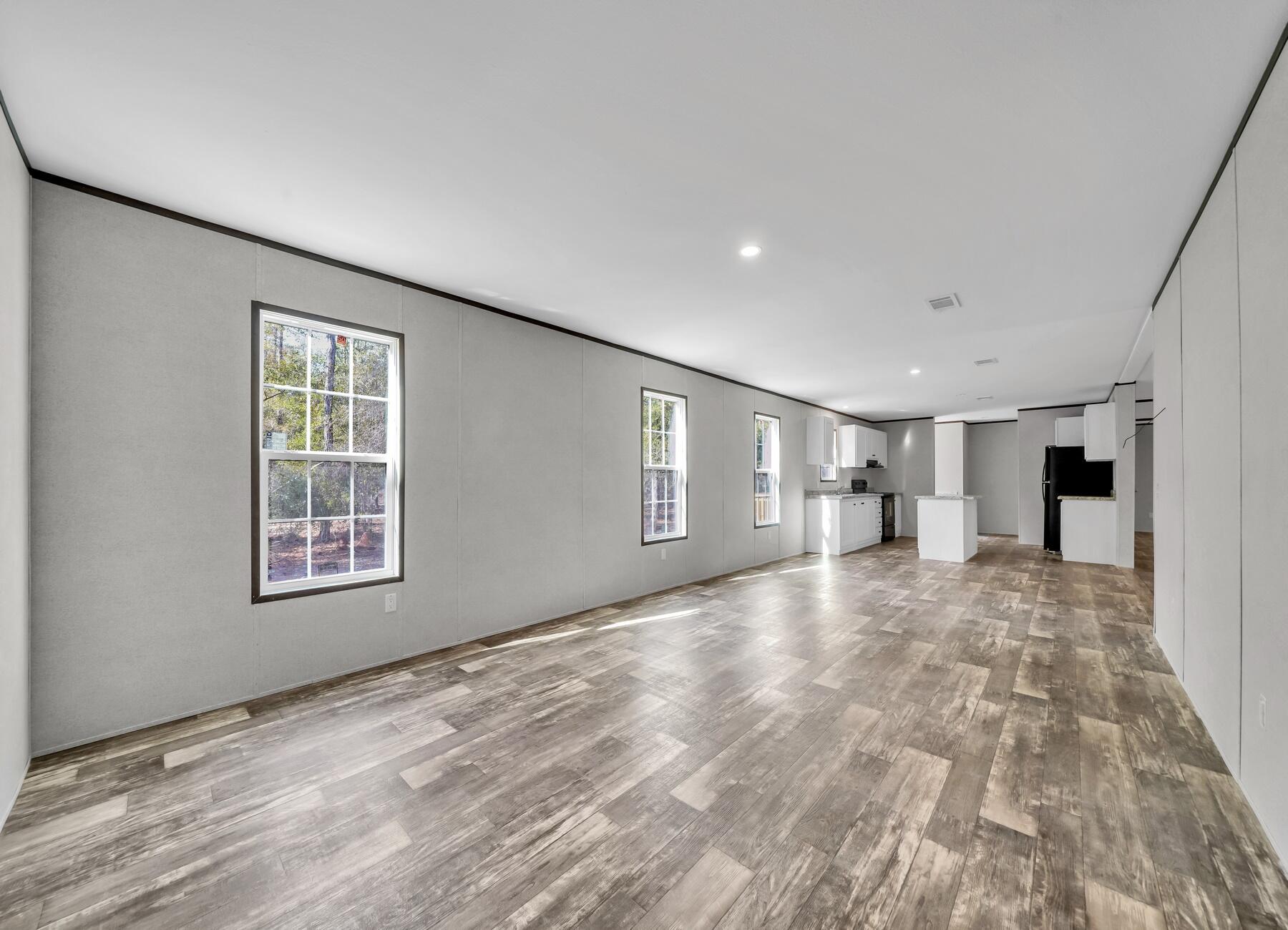 173 Gregory Dean Lane DeFuniak Springs, FL 32433 - Photo 16 of 24 a view of empty room with wooden floor and window
