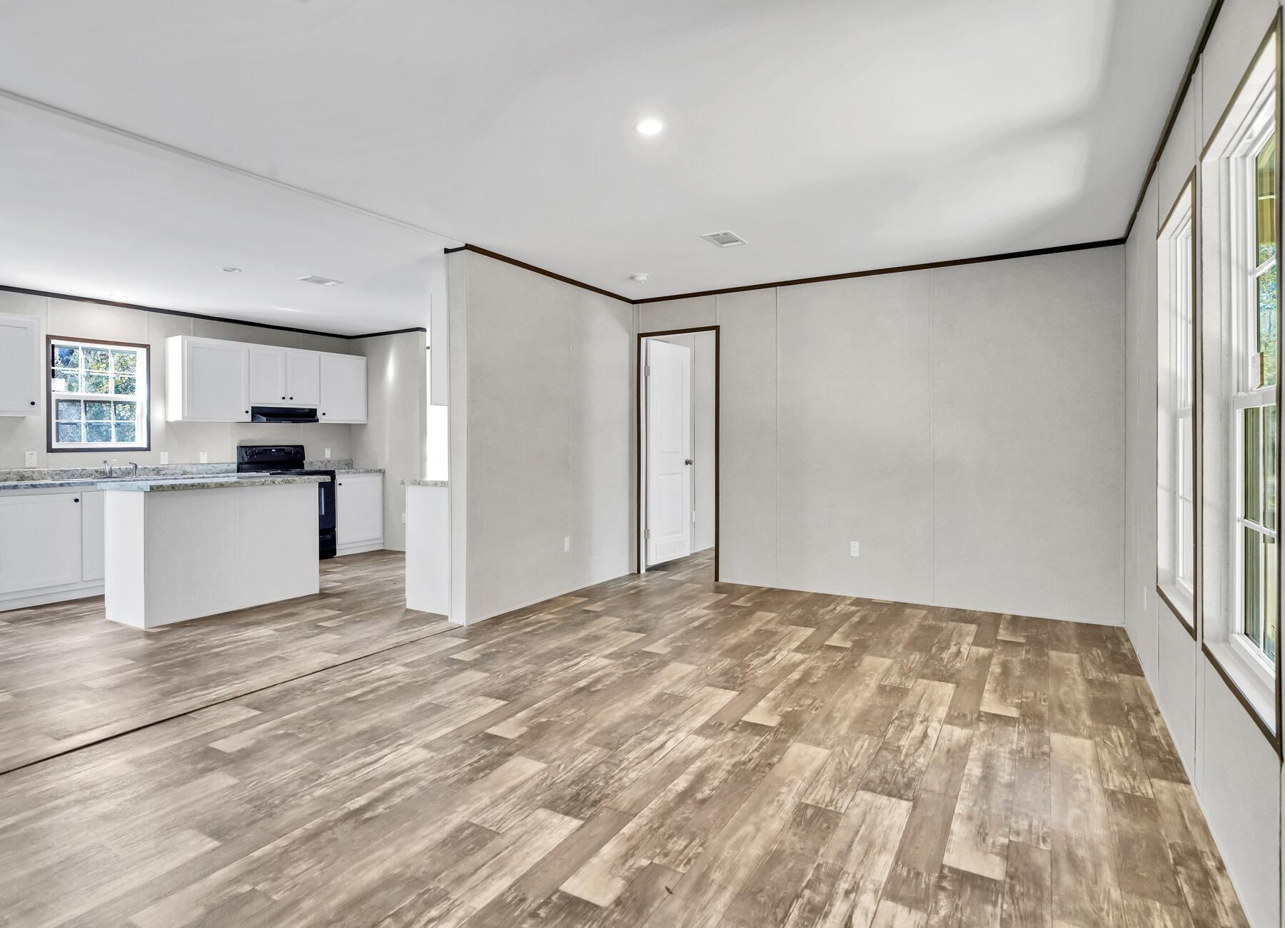 173 Gregory Dean Lane DeFuniak Springs, FL 32433 - Photo 17 of 24 a view of a kitchen with a sink and a refrigerator