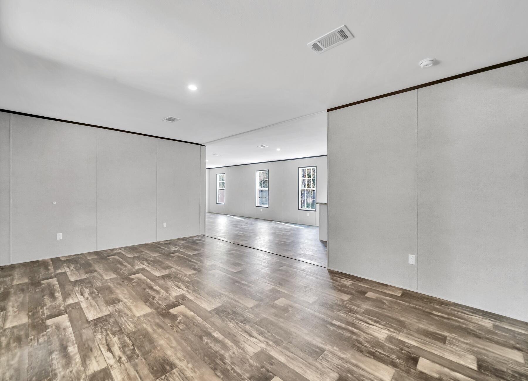 173 Gregory Dean Lane DeFuniak Springs, FL 32433 - Photo 18 of 24 a view of empty room with wooden floor
