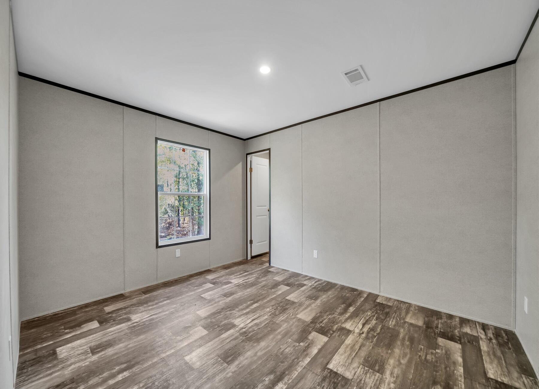 173 Gregory Dean Lane DeFuniak Springs, FL 32433 - Photo 10 of 24 a view of an empty room with a window