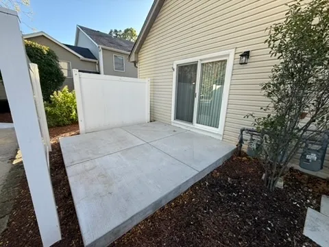 a view of a small space in front of a house