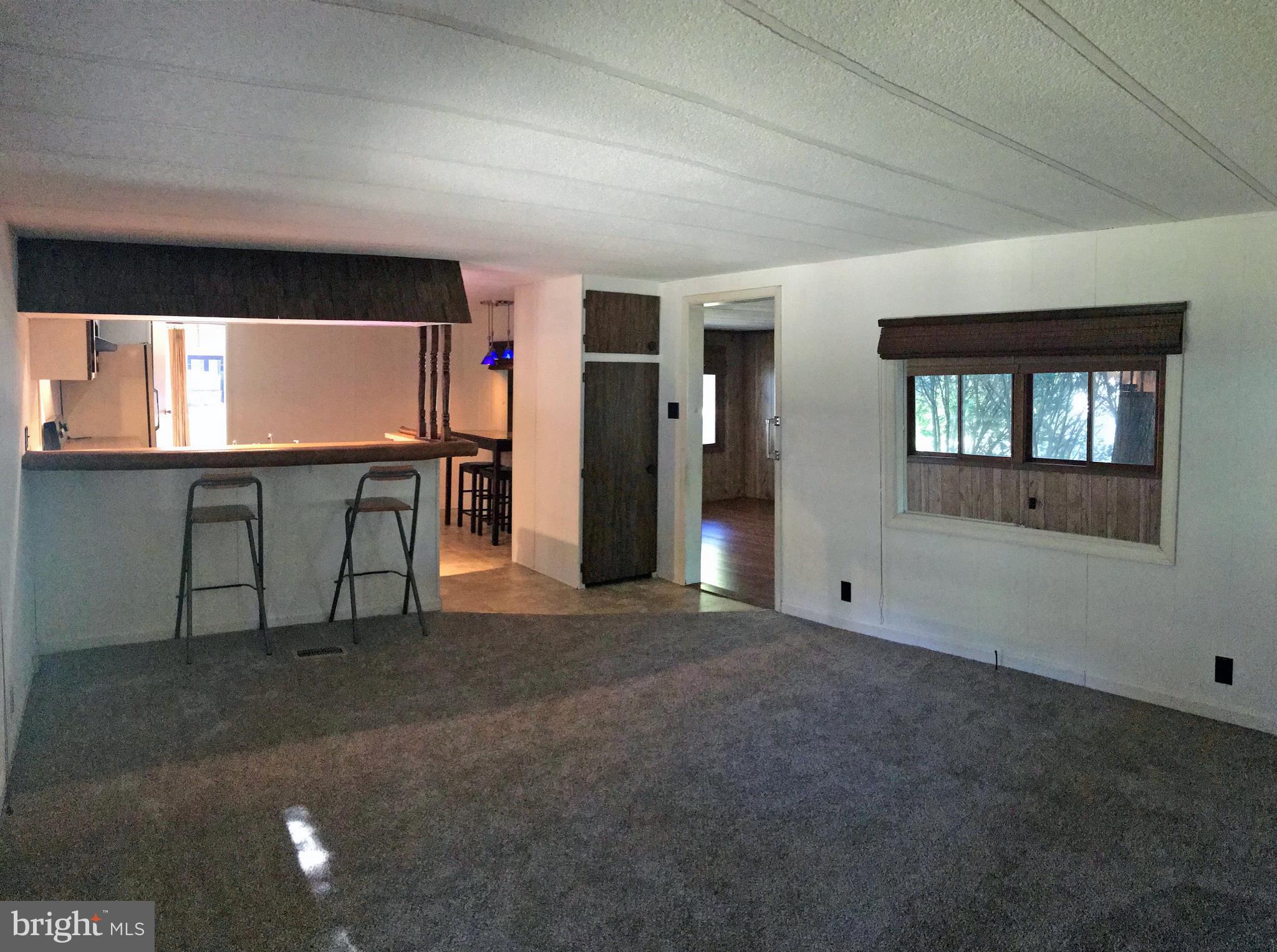 33924 Cedar Road, Unit 76 Lewes, DE 19958 - Photo 4 of 19 Living Room View Toward the Kitchen