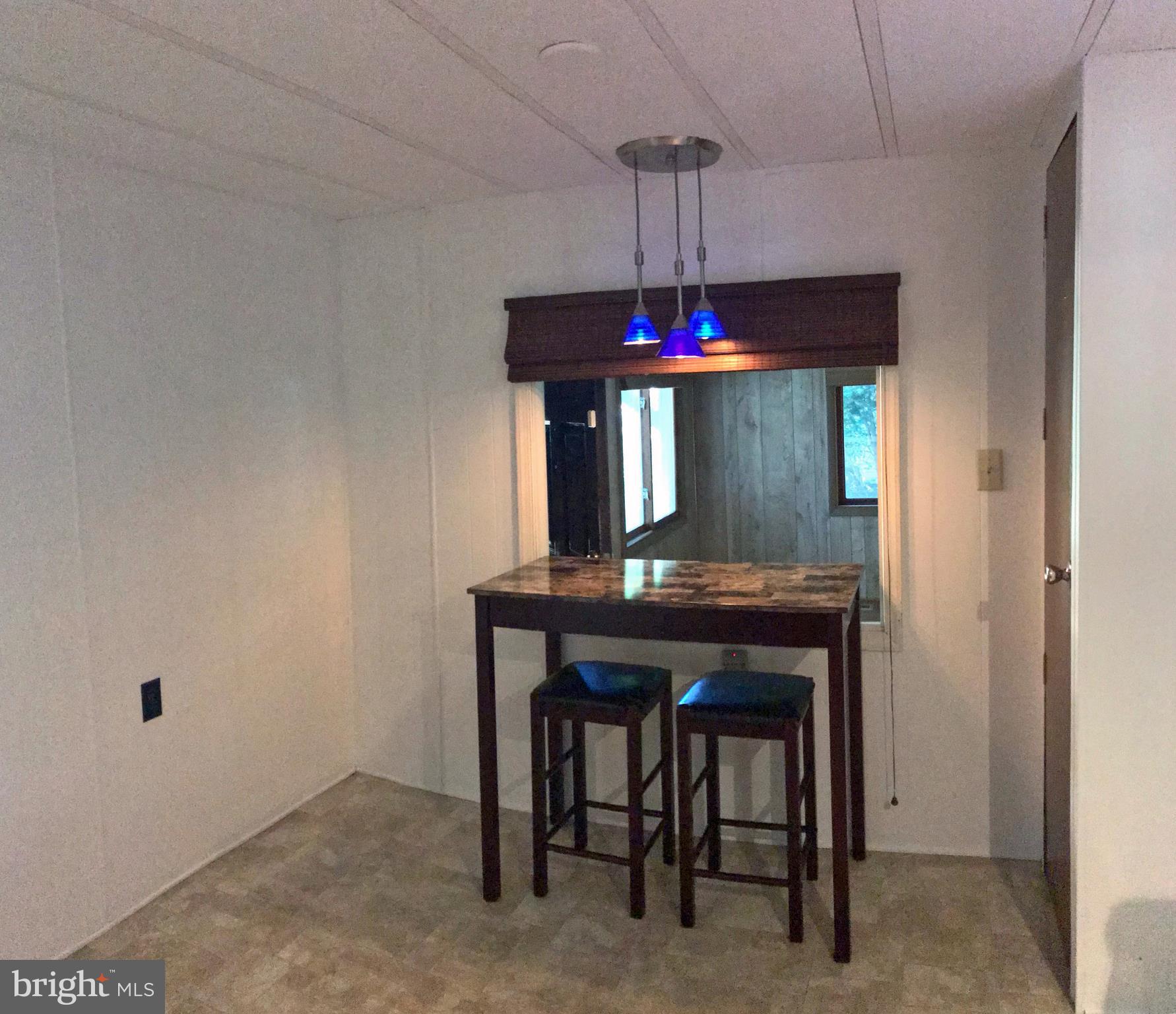 33924 Cedar Road, Unit 76 Lewes, DE 19958 - Photo 8 of 19 Kitchen with Dinette Area