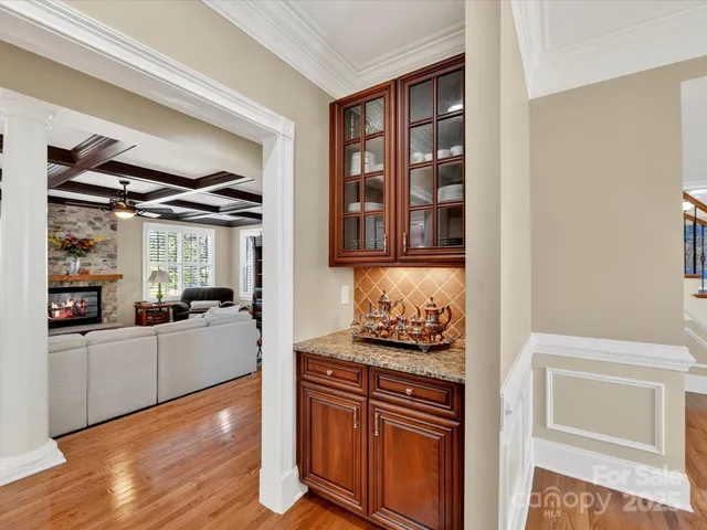 a kitchen with stainless steel appliances granite countertop a stove and cabinets