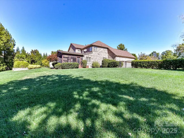 a front view of a house with a yard table and chairs