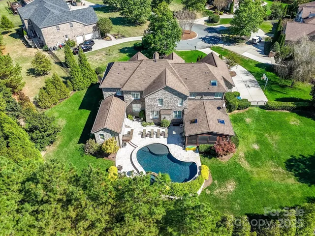 a view of a swimming pool with a patio