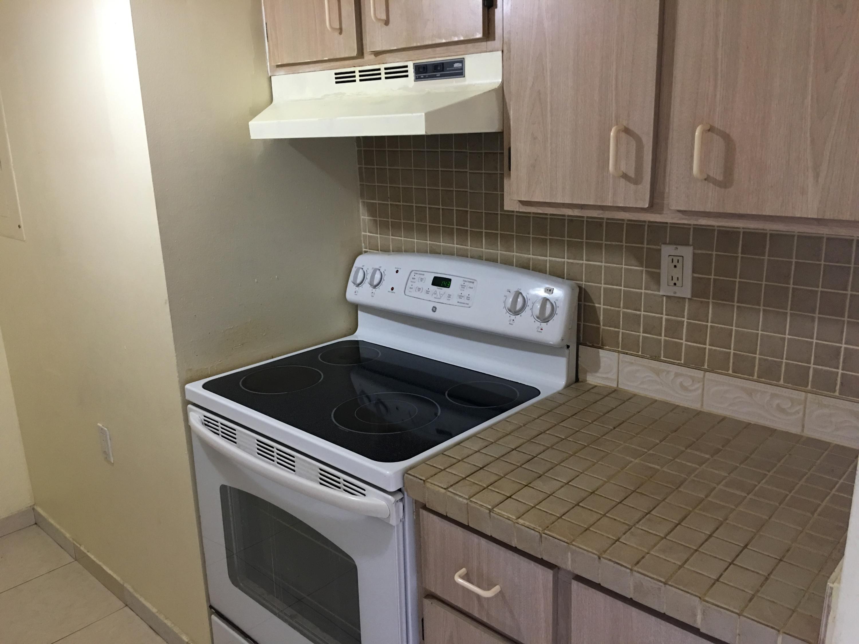 1089 Benoist Farms Road, Unit 306 Royal Palm Beach, FL 33411 - Photo 3 of 9 More Kitchen