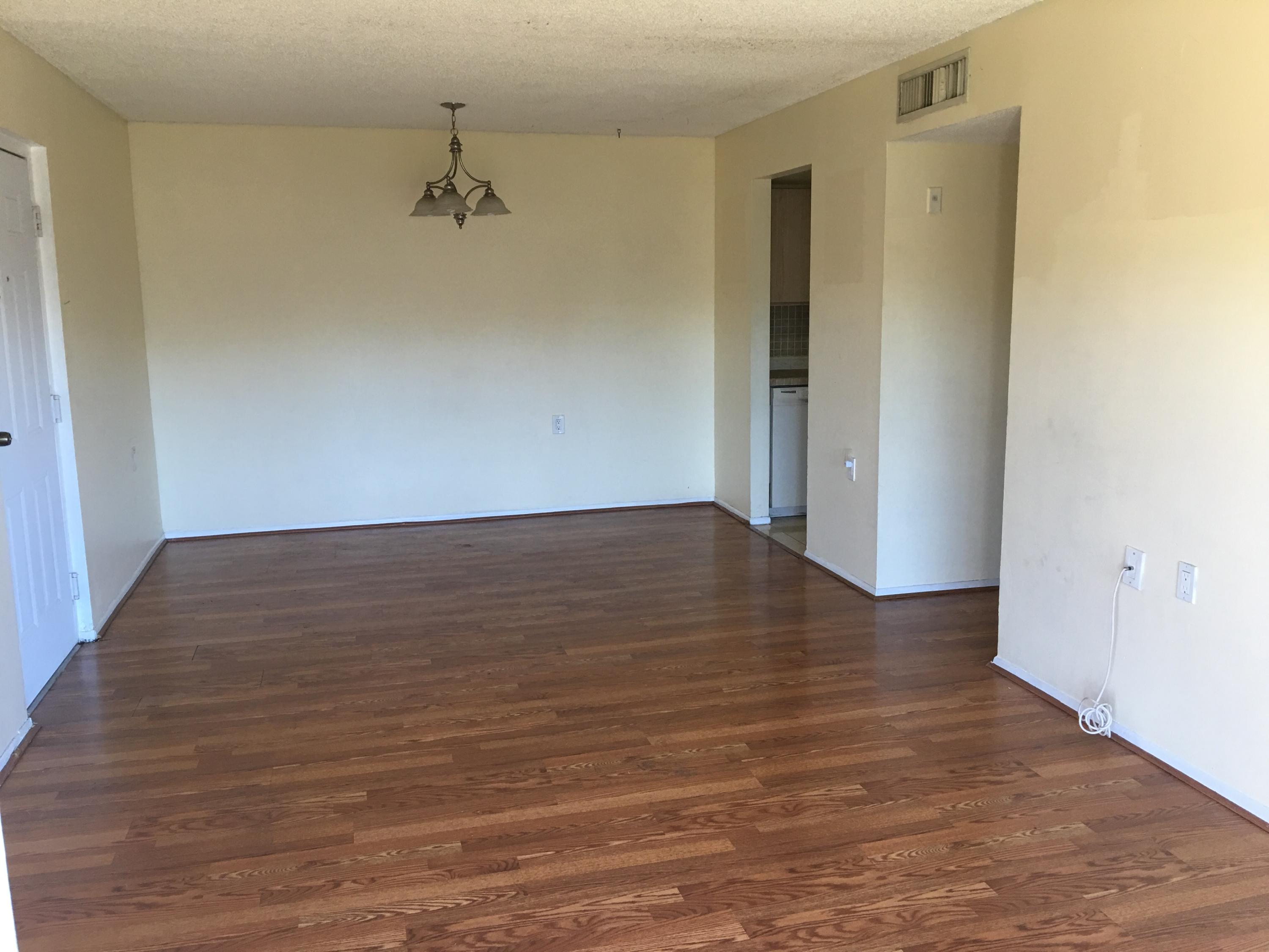 1089 Benoist Farms Road, Unit 306 Royal Palm Beach, FL 33411 - Photo 5 of 9 Great Room & Dining Area