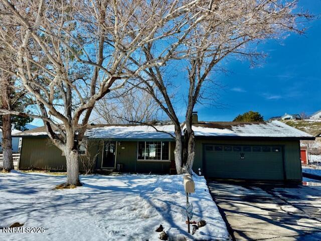 920 Ruby Court Carson City, NV 89705 - Photo 2 of 20 a front view of a house with a yard