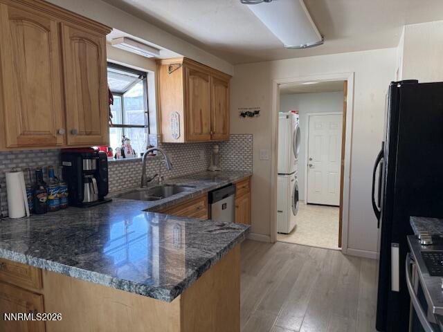 920 Ruby Court Carson City, NV 89705 - Photo 3 of 20 a kitchen with stainless steel appliances granite countertop a refrigerator a stove and a sink with wooden floor