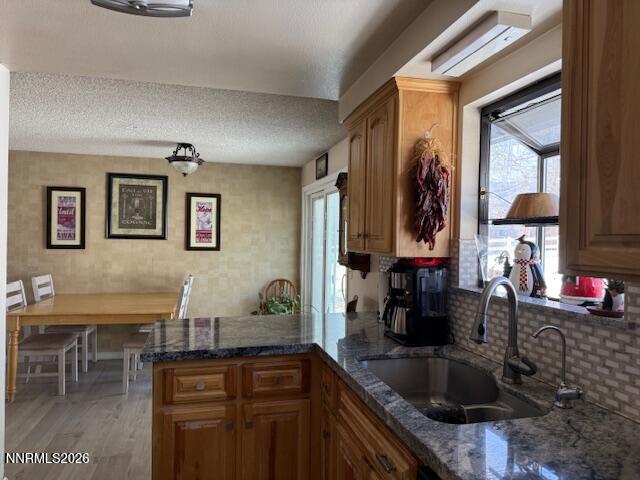 920 Ruby Court Carson City, NV 89705 - Photo 4 of 20 a kitchen with granite countertop a sink and a stove top oven
