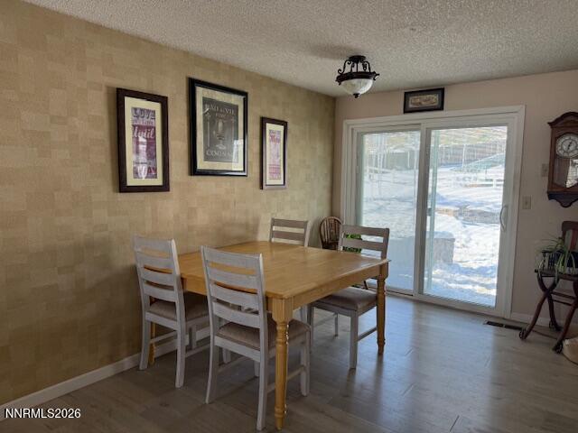 920 Ruby Court Carson City, NV 89705 - Photo 6 of 20 a view of a dining room with furniture and wooden floor