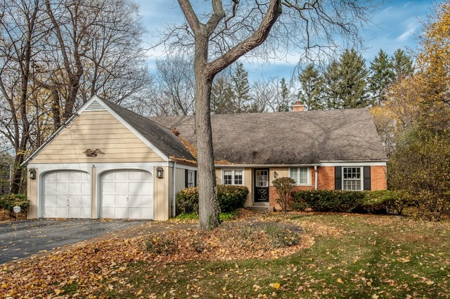 2089 Winnetka Road Northfield, IL 60093 - Photo 1 of 15 a view of a house with a yard and large tree