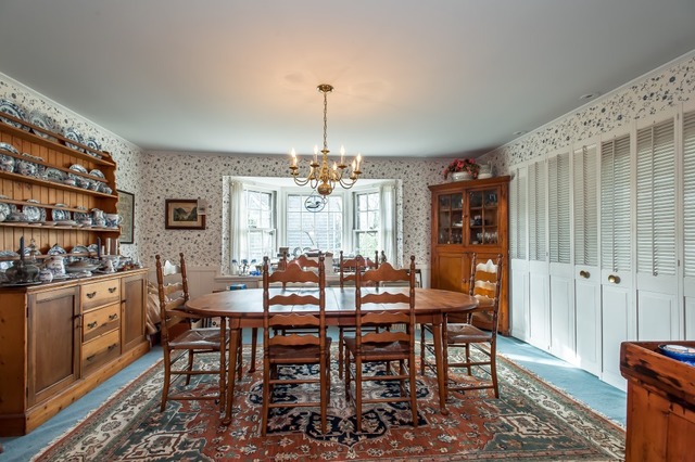 2089 Winnetka Road Northfield, IL 60093 - Photo 4 of 15 a view of a dining room with furniture and chandelier