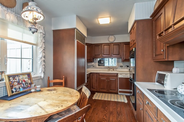 2089 Winnetka Road Northfield, IL 60093 - Photo 5 of 15 a kitchen with stainless steel appliances granite countertop a sink stove and refrigerator