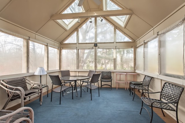 2089 Winnetka Road Northfield, IL 60093 - Photo 7 of 15 a view of a dining room with furniture large windows and wooden floor