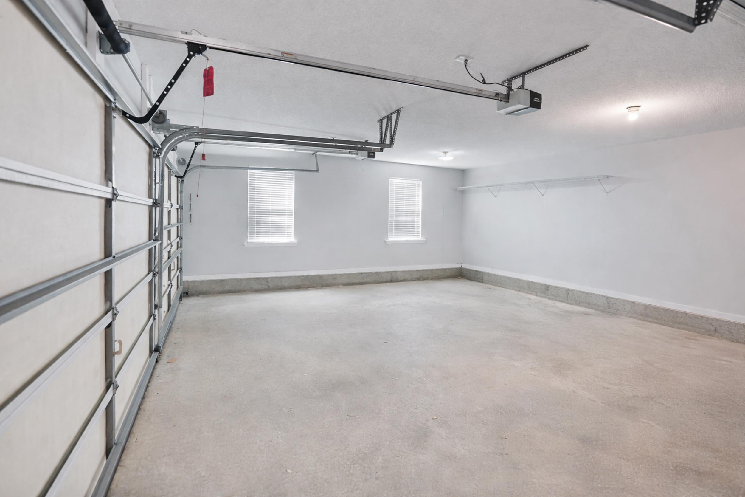 8600 Estrada Street Navarre, FL 32566 - Photo 11 of 63 a view of a room with racks on the wall