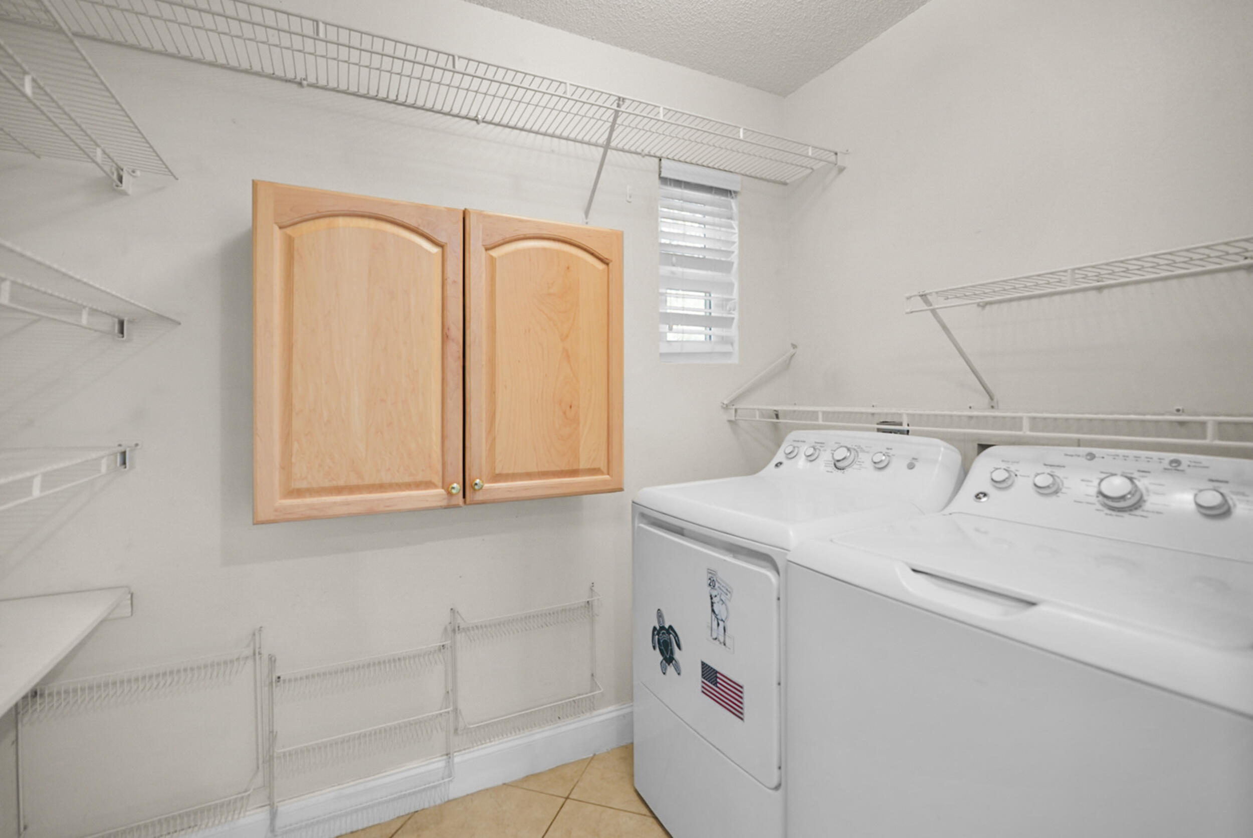 8600 Estrada Street Navarre, FL 32566 - Photo 34 of 63 a utility room with dryer and washer