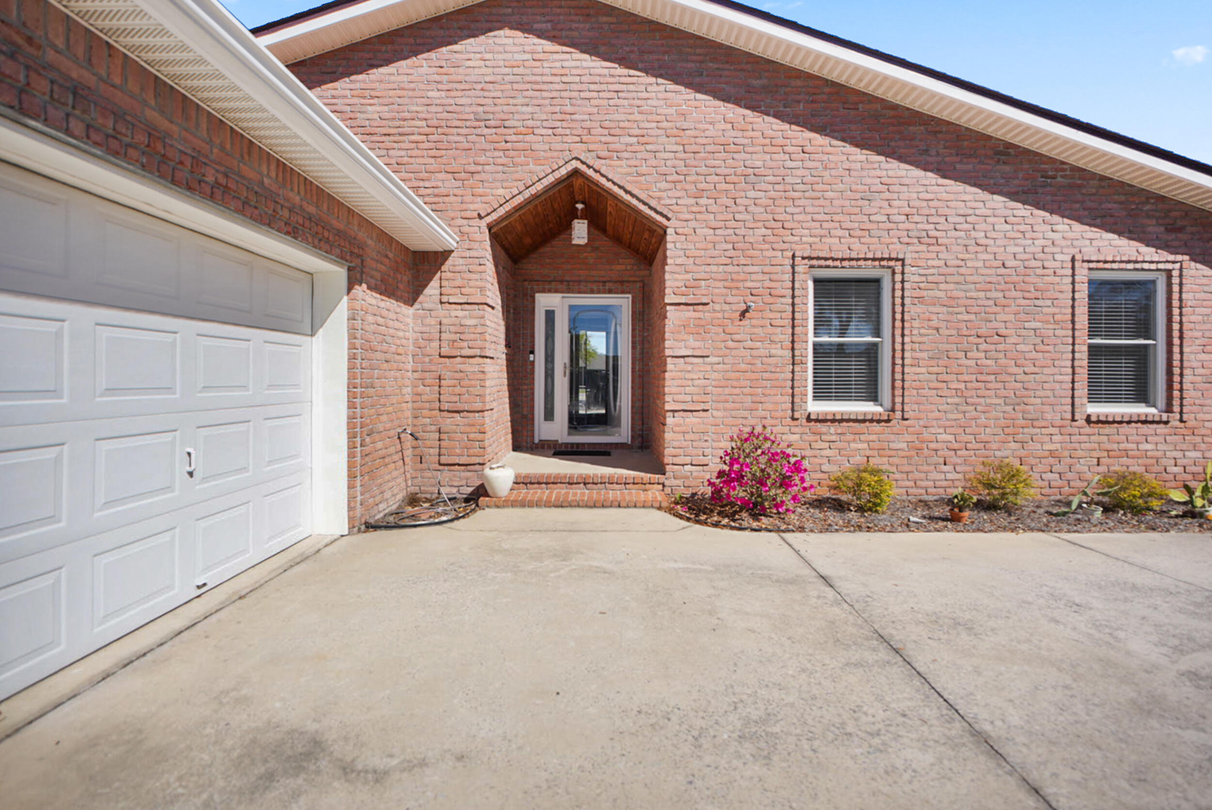 8600 Estrada Street Navarre, FL 32566 - Photo 4 of 63 a view of a house with an outdoor space