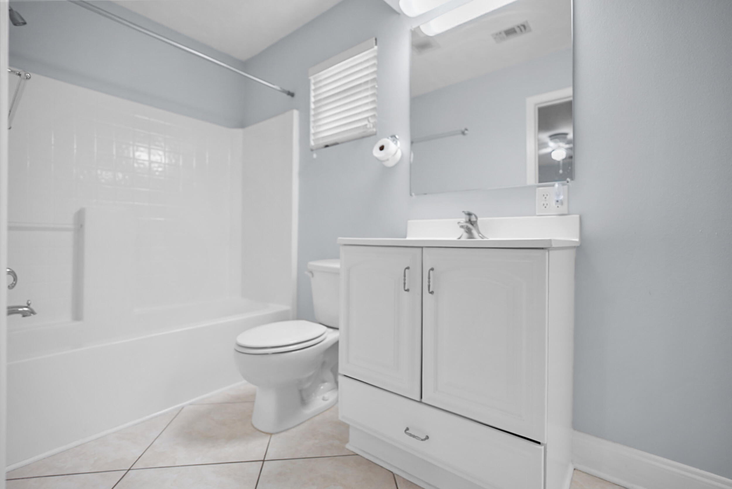 8600 Estrada Street Navarre, FL 32566 - Photo 42 of 63 a bathroom with a sink a toilet and shower