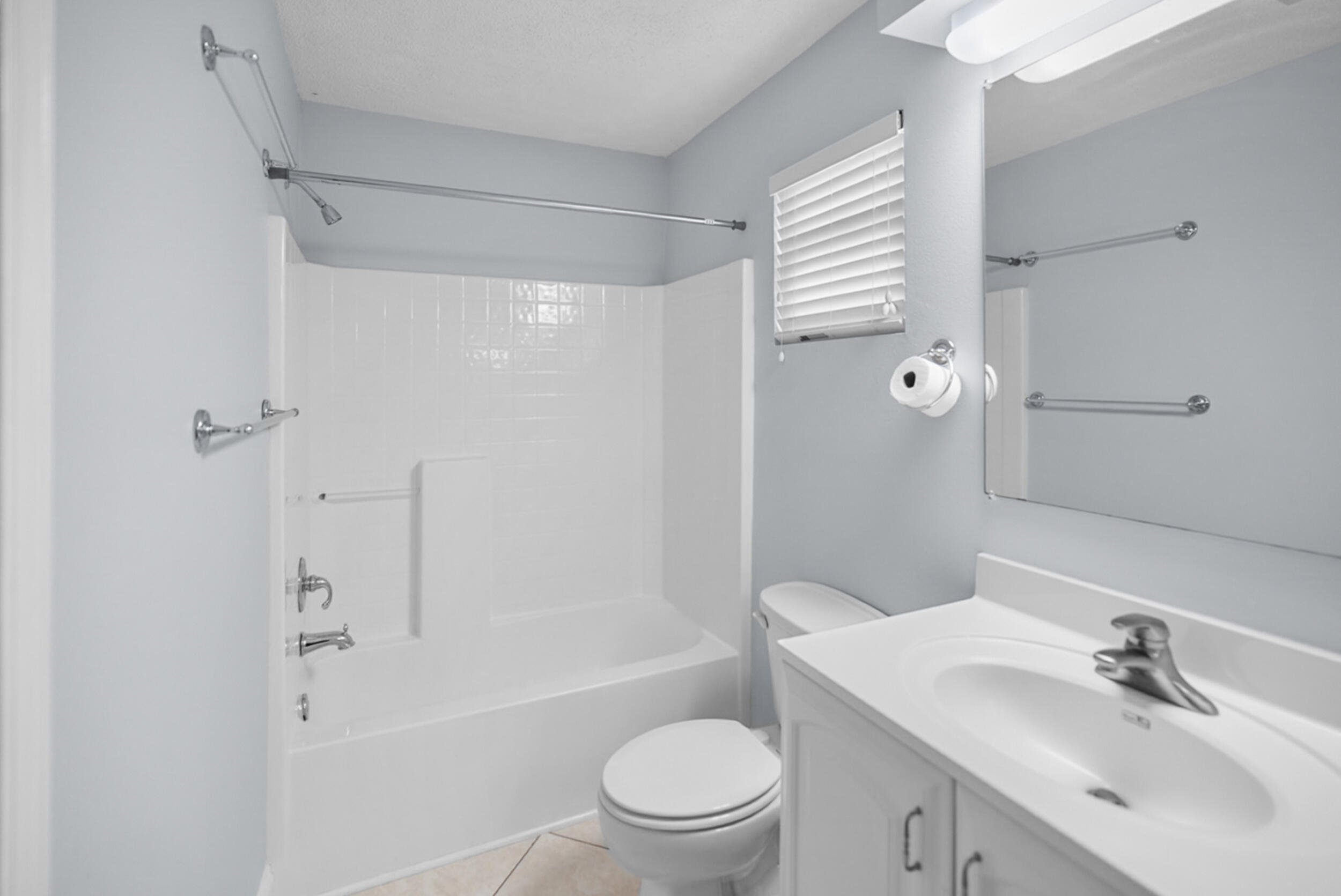 8600 Estrada Street Navarre, FL 32566 - Photo 43 of 63 a bathroom with a sink a toilet and shower
