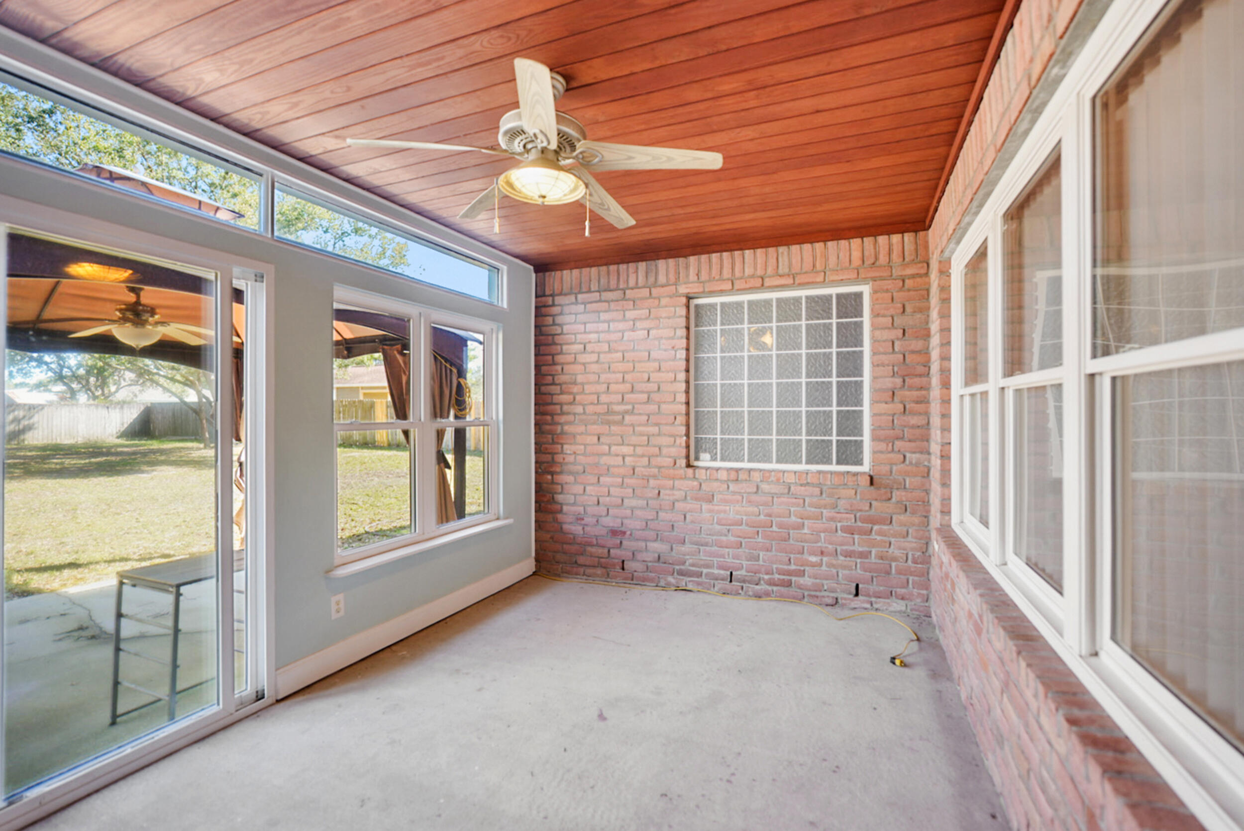 8600 Estrada Street Navarre, FL 32566 - Photo 56 of 63 a view of an empty room with a window