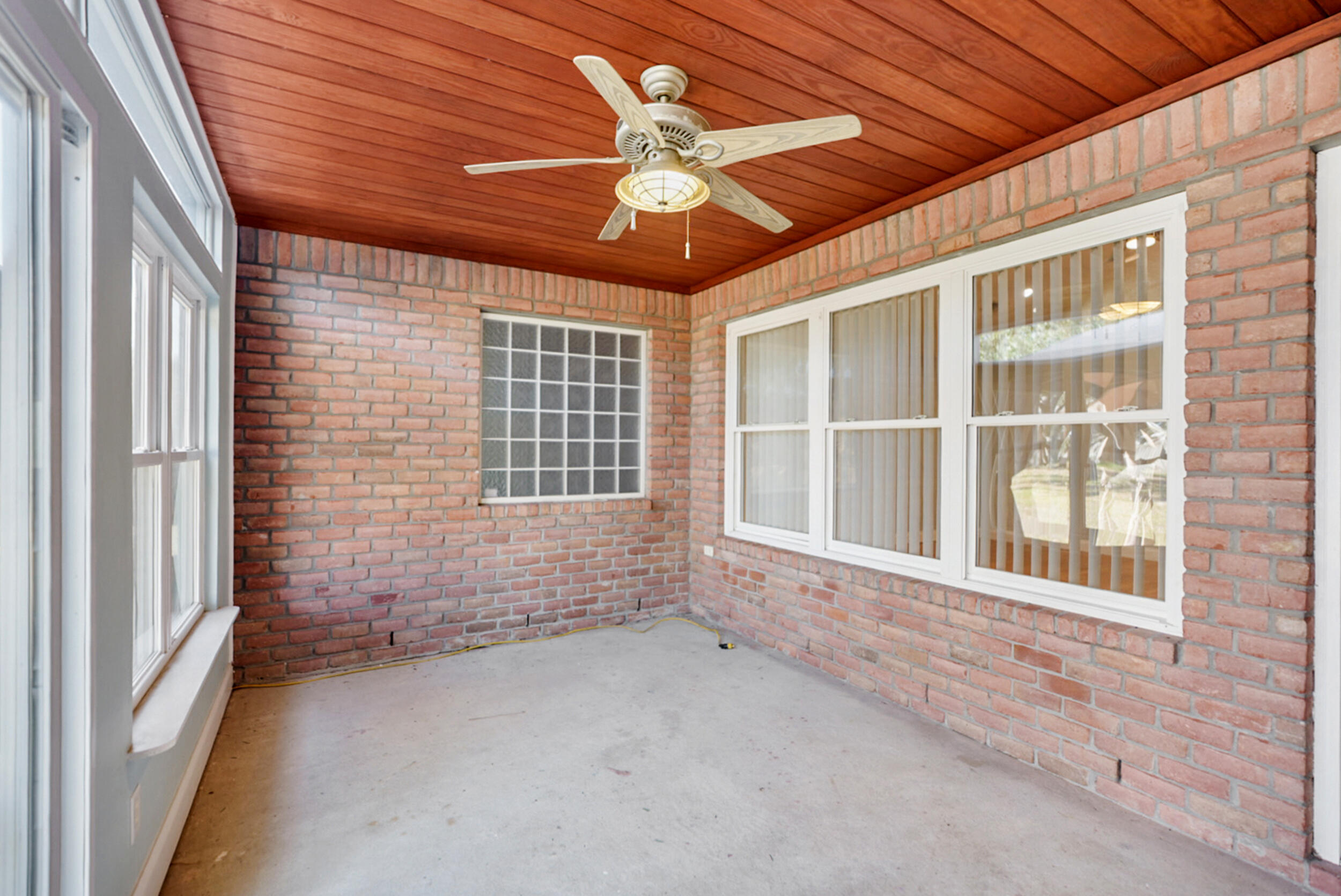 8600 Estrada Street Navarre, FL 32566 - Photo 57 of 63 a view of an empty room with a window