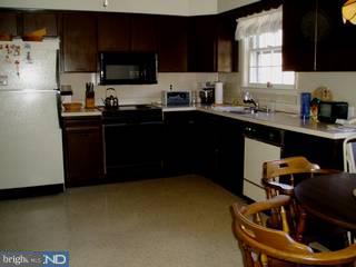 917 Penn Valley Road Media, PA 19063 - Photo 3 of 6 a kitchen with a sink a stove and a refrigerator