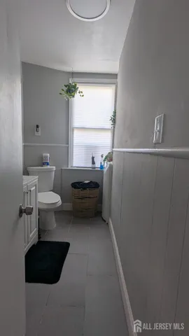 a bathroom with a toilet a sink and a bathtub