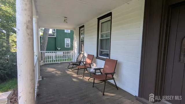 a view of a balcony with chairs