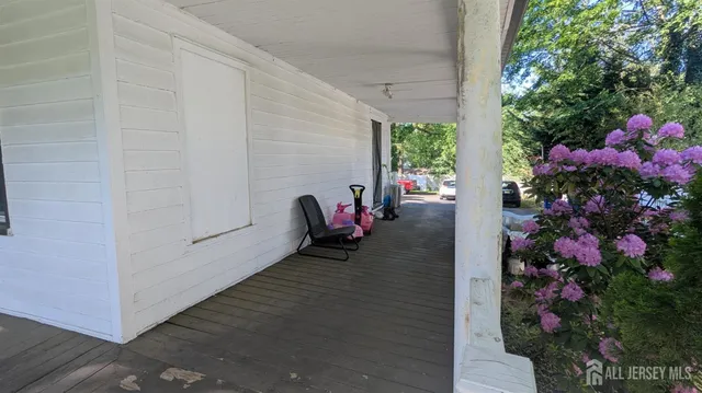 a view of a porch with flowers