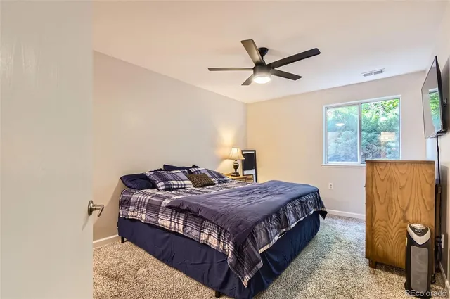 a bedroom with a bed and window