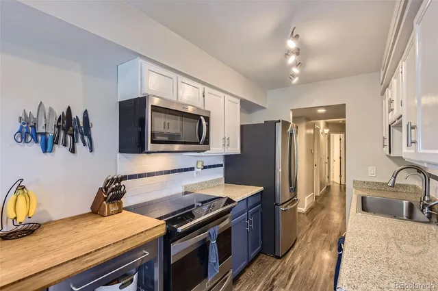 a kitchen with a stove and a sink