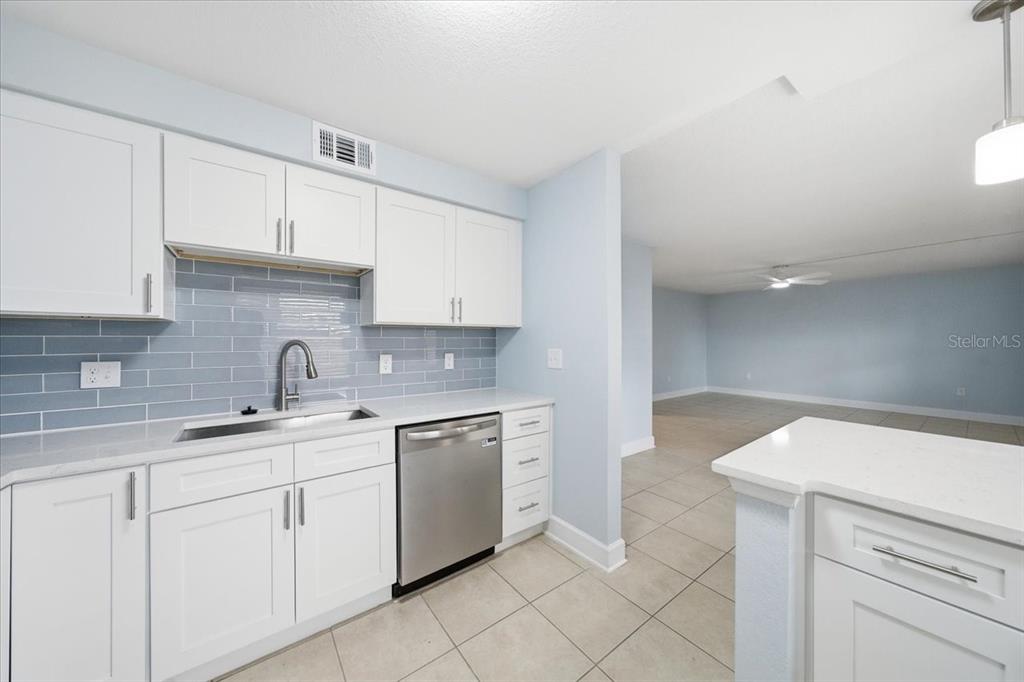 17035 Gulf Boulevard, Unit 118 North Redington Beach, FL 33708 - Photo 21 of 44 a kitchen with a sink and cabinets
