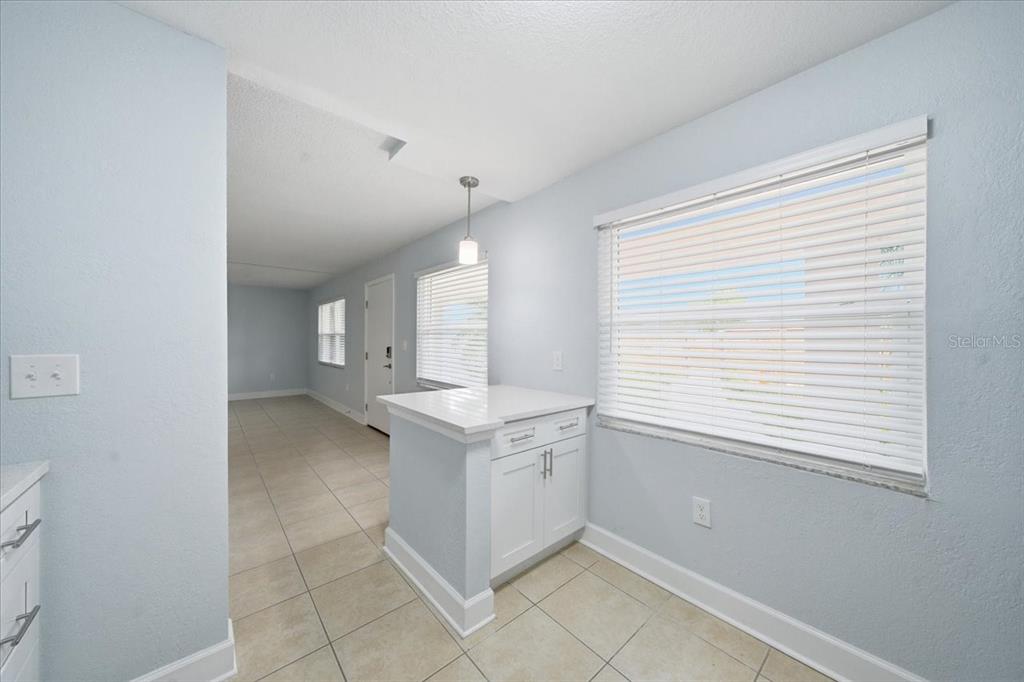 17035 Gulf Boulevard, Unit 118 North Redington Beach, FL 33708 - Photo 22 of 44 a view of a kitchen with white cabinets