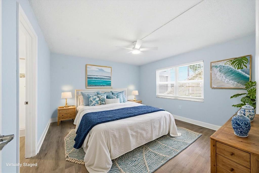 17035 Gulf Boulevard, Unit 118 North Redington Beach, FL 33708 - Photo 23 of 44 a bedroom with a bed and window