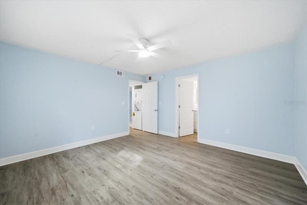 17035 Gulf Boulevard, Unit 118 North Redington Beach, FL 33708 - Photo 26 of 44 a view of an empty room with wooden floor