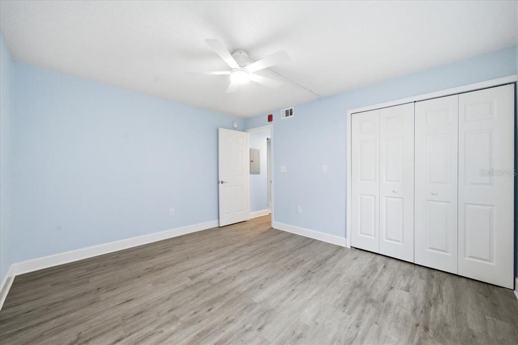 17035 Gulf Boulevard, Unit 118 North Redington Beach, FL 33708 - Photo 30 of 44 a view of an empty room with wooden floor
