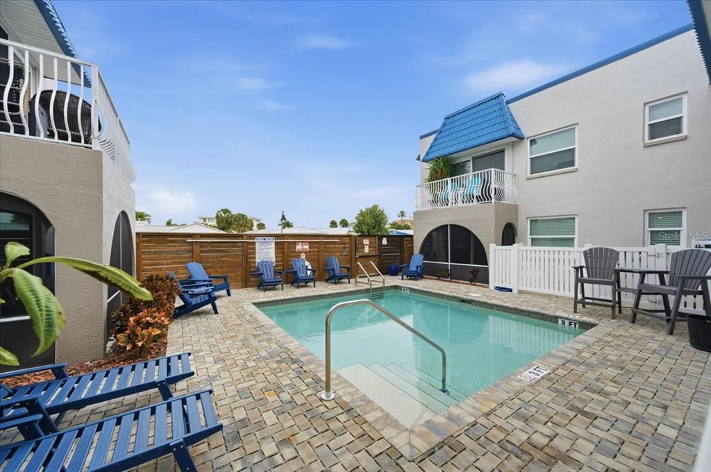 17035 Gulf Boulevard, Unit 118 North Redington Beach, FL 33708 - Photo 35 of 44 a view of a house with swimming pool and sitting area