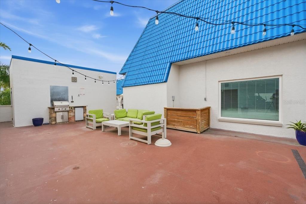 17035 Gulf Boulevard, Unit 118 North Redington Beach, FL 33708 - Photo 36 of 44 a view of a patio with a table and chairs