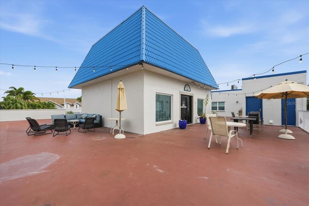 17035 Gulf Boulevard, Unit 118 North Redington Beach, FL 33708 - Photo 37 of 44 a view of a house with patio and a yard