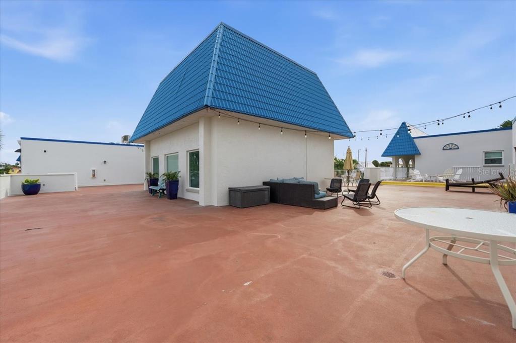 17035 Gulf Boulevard, Unit 118 North Redington Beach, FL 33708 - Photo 39 of 44 a view of a house with backyard and sitting area