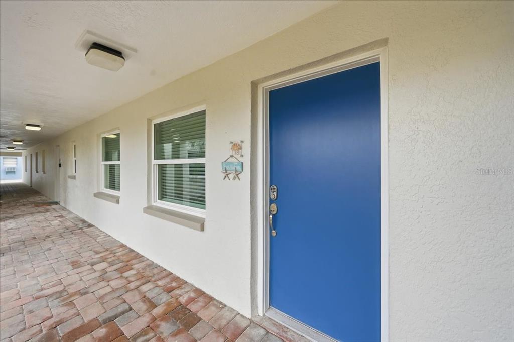 17035 Gulf Boulevard, Unit 118 North Redington Beach, FL 33708 - Photo 4 of 44 a view of a hallway with windows