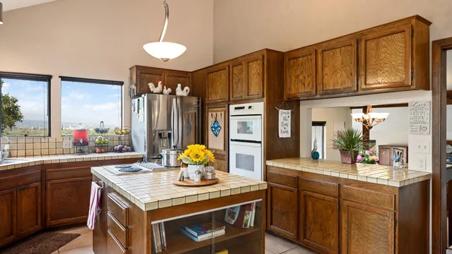 a kitchen with a sink stove and refrigerator