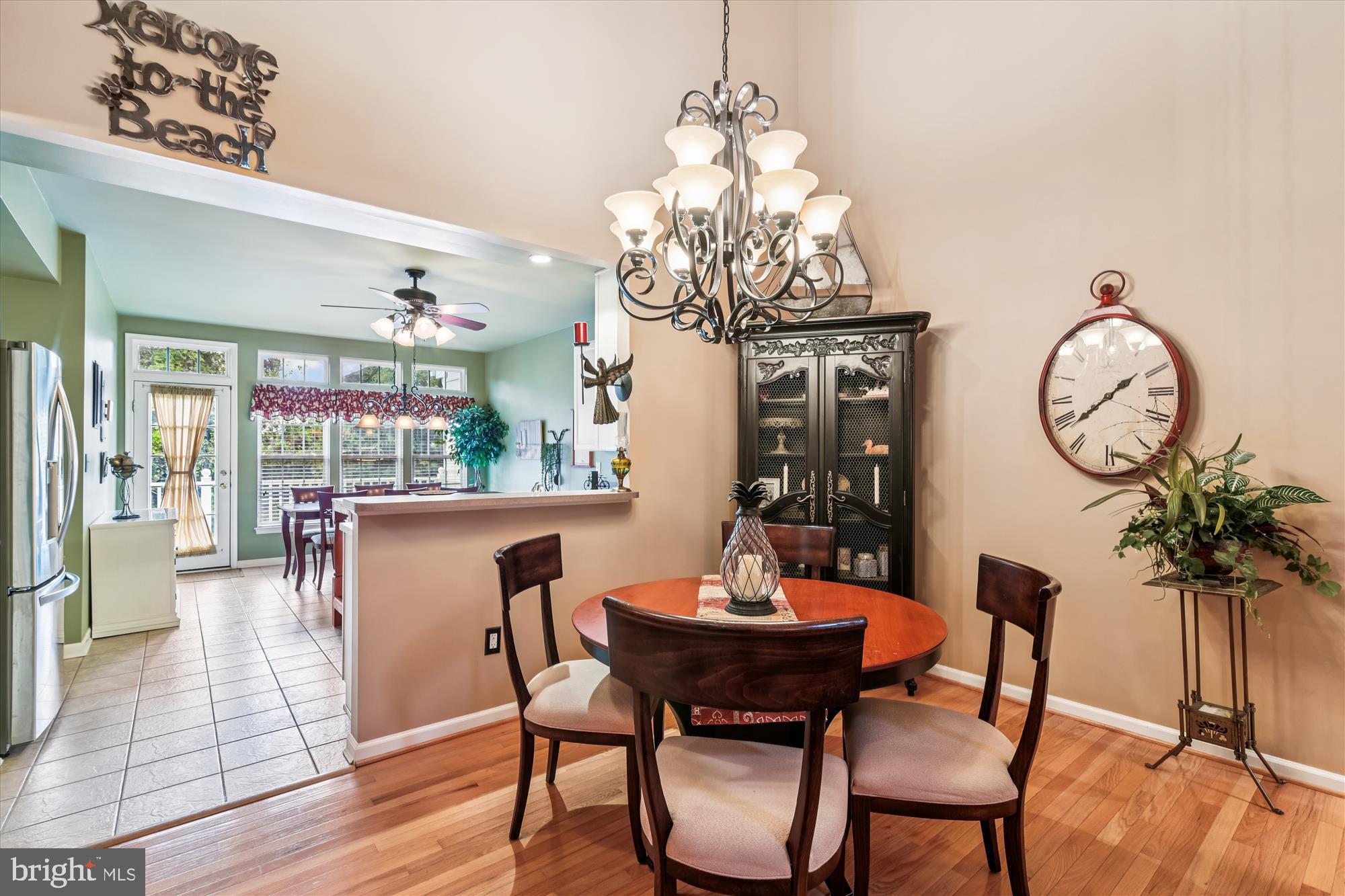 9 Brighton Street Ocean View, DE 19970 - Photo 17 of 48 a view of a dining room with furniture wooden floor and chandelier