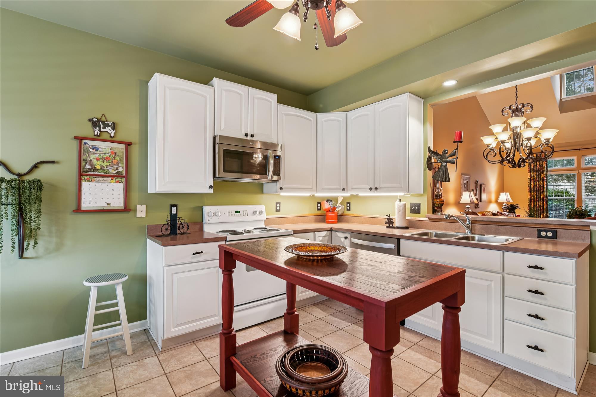 9 Brighton Street Ocean View, DE 19970 - Photo 18 of 48 a kitchen with a stove cabinets and a refrigerator