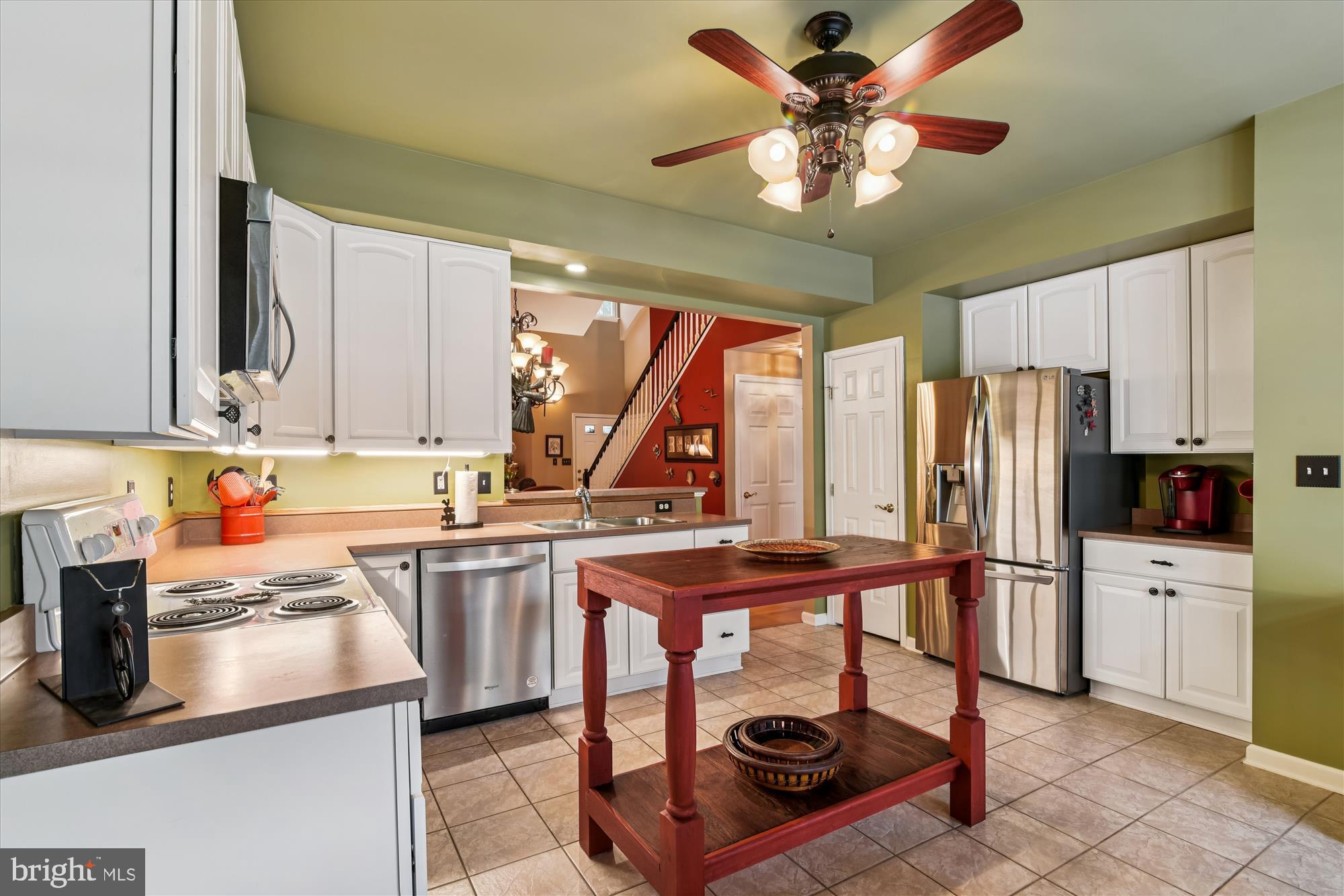 9 Brighton Street Ocean View, DE 19970 - Photo 19 of 48 a kitchen with stainless steel appliances granite countertop a stove refrigerator and cabinets