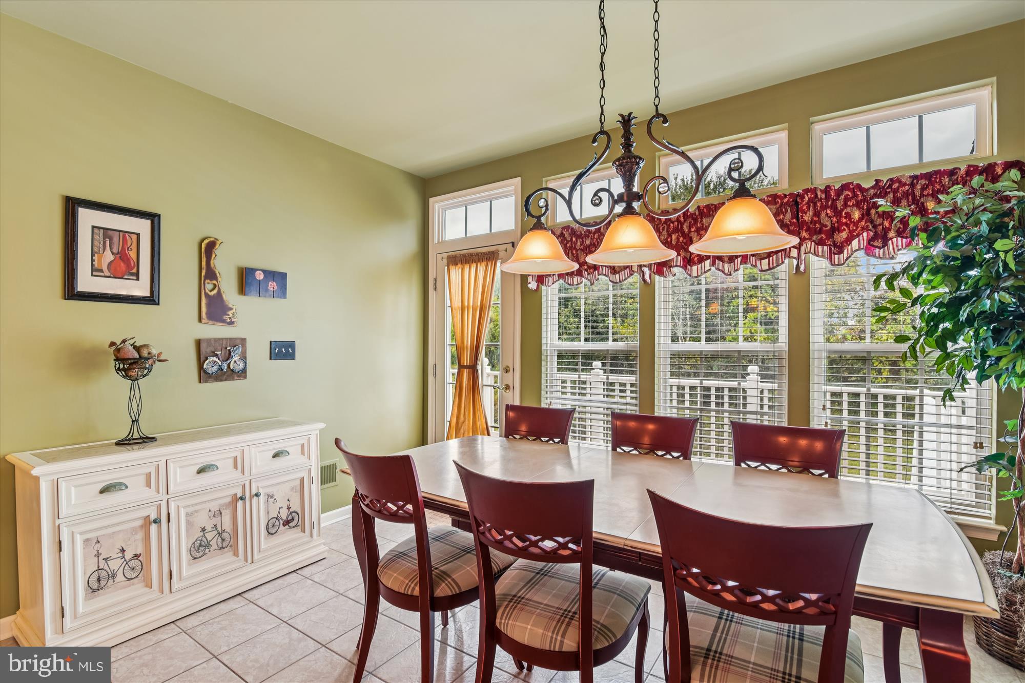 9 Brighton Street Ocean View, DE 19970 - Photo 22 of 48 a dining room with furniture a chandelier and wooden floor